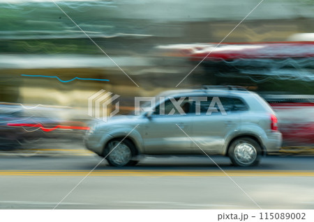 Speeding vehicle on the street 115089002