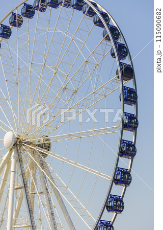 Ferris wheel on blue sky 115090682
