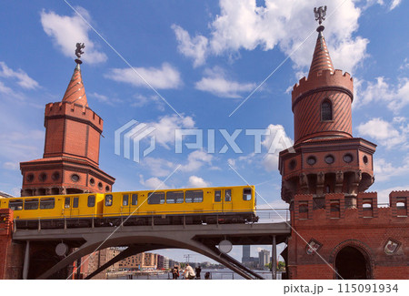 Yellow carriages of the famous Berlin metro on a sunny day. 115091934