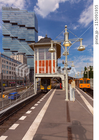 Yellow carriages of the famous Berlin metro on a sunny day. 115091935