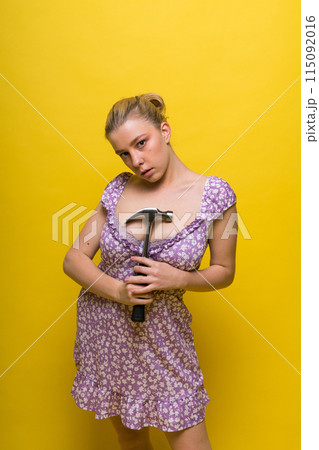 Seductive female handyman is going to fix it all, studio shot 115092016