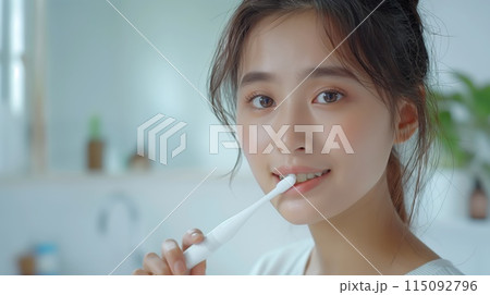 beautiful Chinese woman brushes her teeth in the bathroom 115092796
