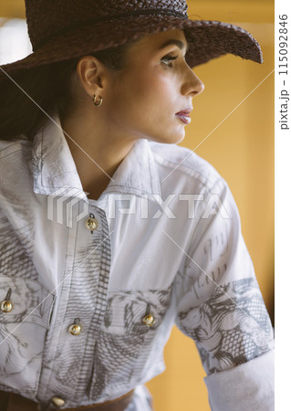 Indoor portrait of a young beautiful fashionable woman wearing stylish accessories. 115092846