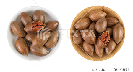 pecan nut in ceramic bowl isolated on white background with full depth of field. Top view. Flat lay. 115094698
