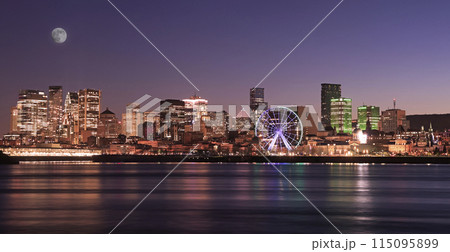 Montreal skyline illuminated at dusk and reflected in St. Lawrence River, Quebec, Canada Montreal skyline illuminated at dusk and reflected in St. Lawrence River, Quebec, Canada 115095899