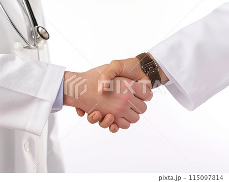Close-up of two doctors shaking hands, symbolizing partnership, trust, and collaboration in healthcare. 115097814