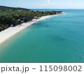 Aerial view of a blue sea surface water texture background and sun reflections Aerial flying drone view water surface texture on sunny tropical ocean 115098002