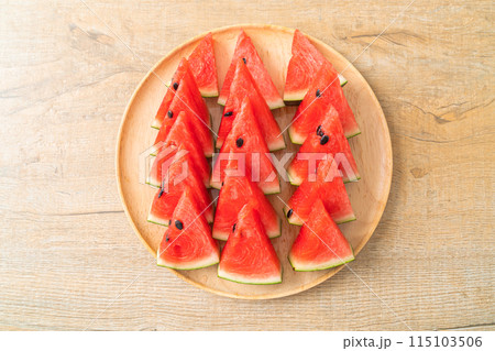 fresh watermelon sliced on plate 115103506