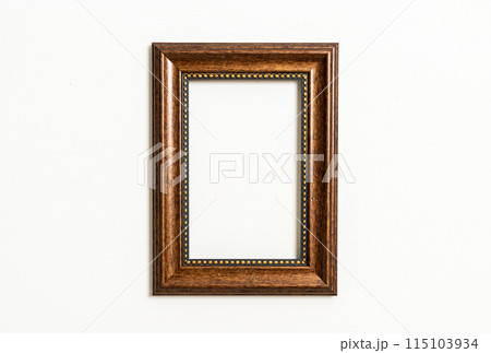 empty picture frame on white wall background 115103934