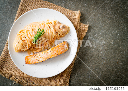 grilled salmon with spaghetti creamy tomato sauce 115103953