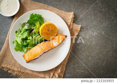 fried salmon steak with lemon and vegetable fried salmon steak with lemon and vegetable 115103955
