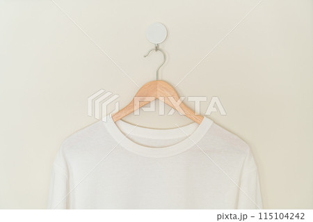 t-shirt hanging with wood hanger t-shirt hanging with wood hanger 115104242