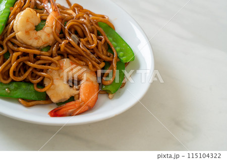 stir-fried yakisoba noodles with green peas and shrimps stir-fried yakisoba noodles with green peas and shrimps 115104322