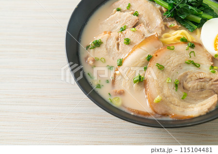 Ramen noodles in pork bone soup with roast pork and egg 115104481