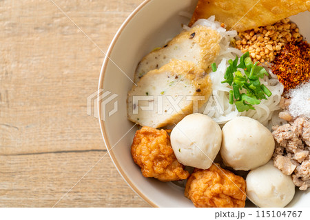 spicy small flat rice noodles with fish balls and shrimp balls without soup spicy small flat rice noodles with fish balls and shrimp balls without soup 115104767
