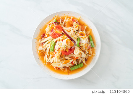 Som Tum - Thai Spicy green papaya salad with salty eggs Som Tum - Thai Spicy green papaya salad with salty eggs 115104860