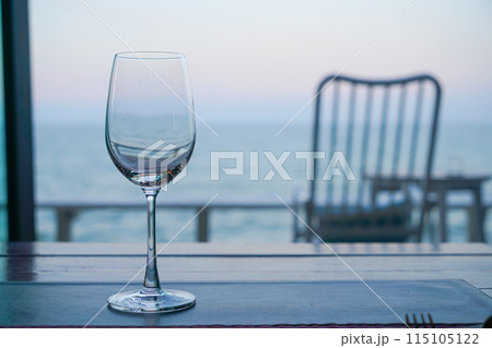 empty wine glass with sea background empty wine glass with sea background 115105122