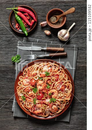 shrimp fra diavolo with spaghetti on a plate shrimp fra diavolo with spaghetti on a plate 115109582