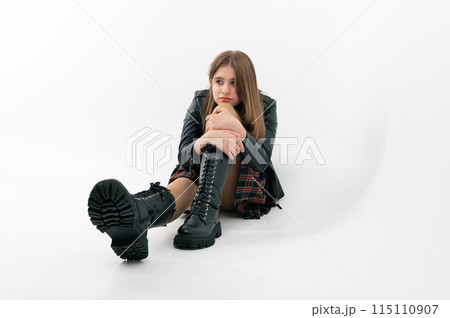 Young girl pouted. Studio portrait of sad teenage girl on white background Young girl pouted. Studio portrait of sad teenage girl on white background 115110907