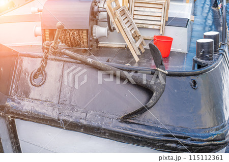 Rope and anchor detail on boat 115112361