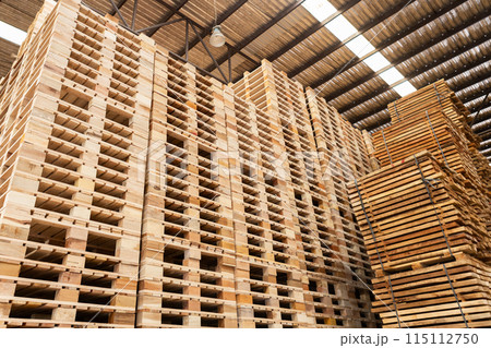 Stack of raw wood, Lumber warehouse storage wooden. Timber goods storehouse. 115112750