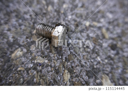 Detail of old broken and rusty industrial nut 115114445