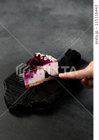 Blueberry cheesecake. On a black background Blueberry cheesecake. On a black background 115116443
