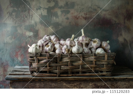 Garlic in a wicker basket on a wooden table. Rustic style. Garlic in a wicker basket on a wooden table. Rustic style. 115120283