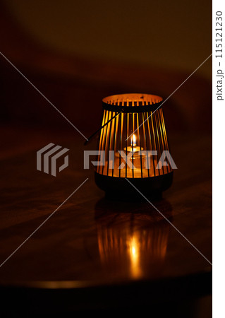 single tea light candle on the table single tea light candle on the table 115121230