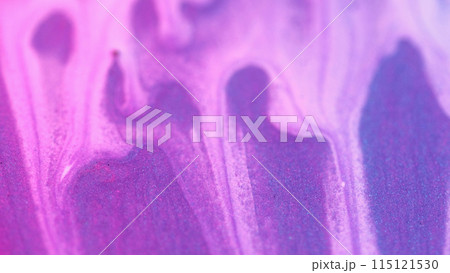 Paint drip. Flowing liquid. Abstract white ink drop flow sparkling motion down at glittered colored purple grained metallic textured background blur. 115121530