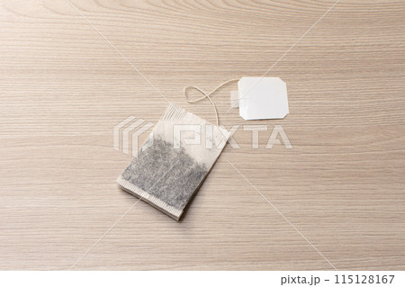 tea bag for brewing on a light wooden background tea bag for brewing on a light wooden background 115128167