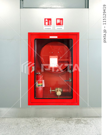 Fire hose cabinet in an office building to prepare for fire protection. Fire hose cabinet in an office building to prepare for fire protection. 115129419