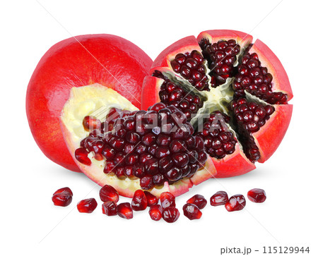 Sliced Red pomegranate isolated on white background. Sliced Red pomegranate isolated on white background. 115129944