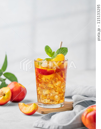 Refreshing peach iced mint tea. The concept of a healthy homemade cold summer drink 115133295