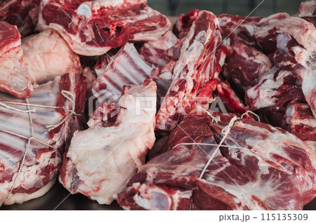 Fresh raw lamb meat on counter for cooking traditional Asian Uzbek pilaf in bazaar in Tashkent in Uzbekistan Fresh raw lamb meat on counter for cooking traditional Asian Uzbek pilaf in bazaar in Tashkent in Uzbekistan 115135309