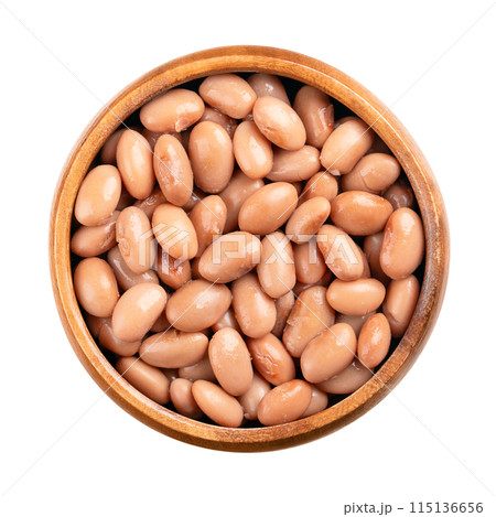 Borlotti beans in a wooden bowl. Cooked and canned cranberry beans, a hazelnut-colored variety of the common bean, Phaseolus vulgaris. Vegetarian staple food. Isolated, from above close-up food photo. 115136656