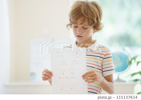 Kids fail math test in school. Child after exam. Kids fail math test in school. Child after exam. 115137614