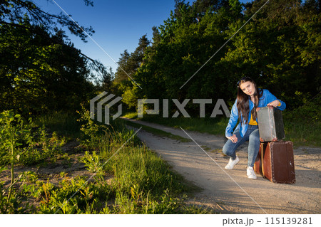 The teenager has returned home to her country after a wonderful vacation trip and is waiting for her family to take her home. 115139281