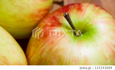 Juicy Apples Variety. A selection of ripe apples, emphasizing their juiciness, ideal for grocery ads. 115141694