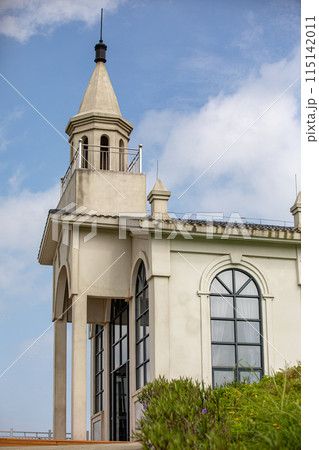 The Church Tower boasts majestic architecture under a clear blue sky, looking beautiful and serene 115142011