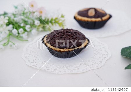 delicious little chocolate cookies as a background delicious little chocolate cookies as a background 115142497