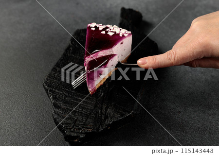 Blueberry cheesecake. On a black background 115143448
