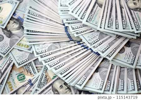 Very big amount of US hundred dollar bills close up. Huge quantity of united states currency notes on flat table Very big amount of US hundred dollar bills close up. Huge quantity of united states currency notes on flat table 115143719