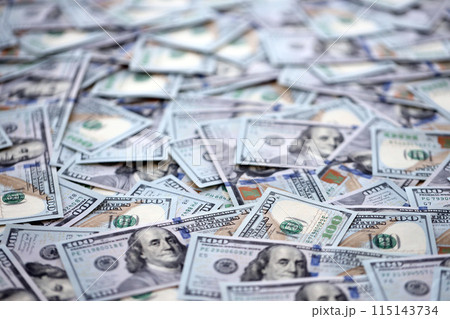 Very big amount of US hundred dollar bills close up. Huge quantity of united states currency notes on flat table Very big amount of US hundred dollar bills close up. Huge quantity of united states currency notes on flat table 115143734