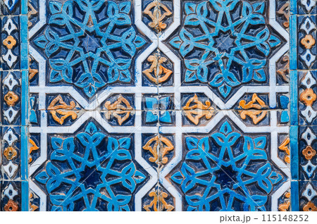ancient ceramic tile with traditional Arabic pattern Uzbek ornament decorates the wall of islamic Hazrati Imam mosque in Tashkent in Uzbekistan 115148252