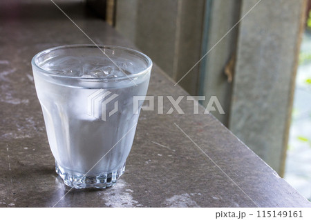 Water glass with some ice Water glass with some ice 115149161