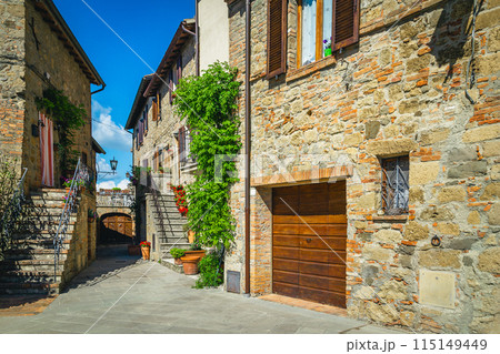 Cozy street view, stone houses decorated with green plants, Italy Cozy street view, stone houses decorated with green plants, Italy 115149449