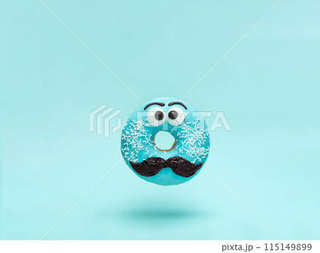 Blue glazed donut with mustache flying Blue glazed donut with mustache flying 115149899