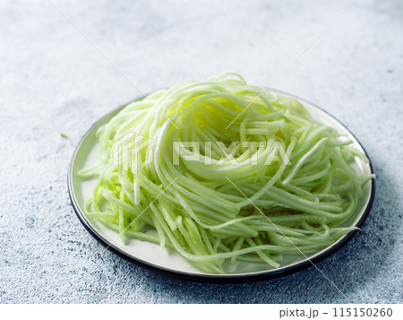 Zucchini noodles on plate. 115150260
