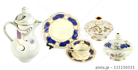 Vintage porcelain tableware isolated on white. Collage. Wide photo. Vintage porcelain tableware isolated on white. Collage. Wide photo. 115150333